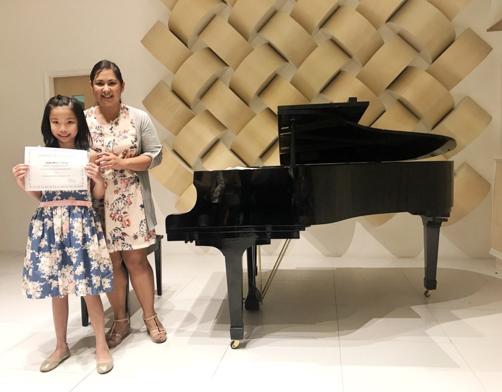 Teacher Cel with one of her students