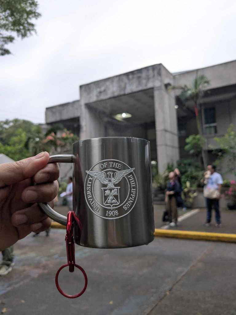outdoor mug with the campus logo